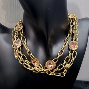 Long gold necklace with rose gold stones. Great gift for someone special!